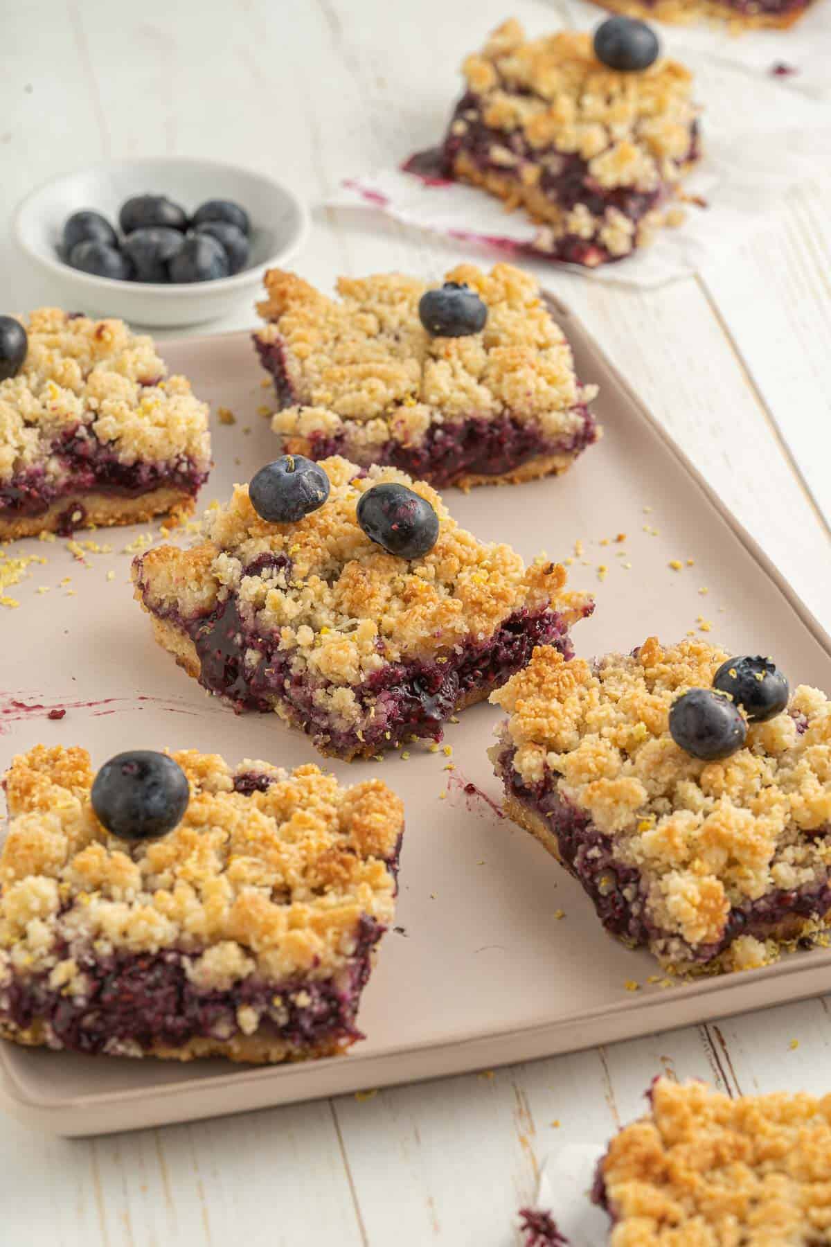 blueberry crumble bars on a baking tray