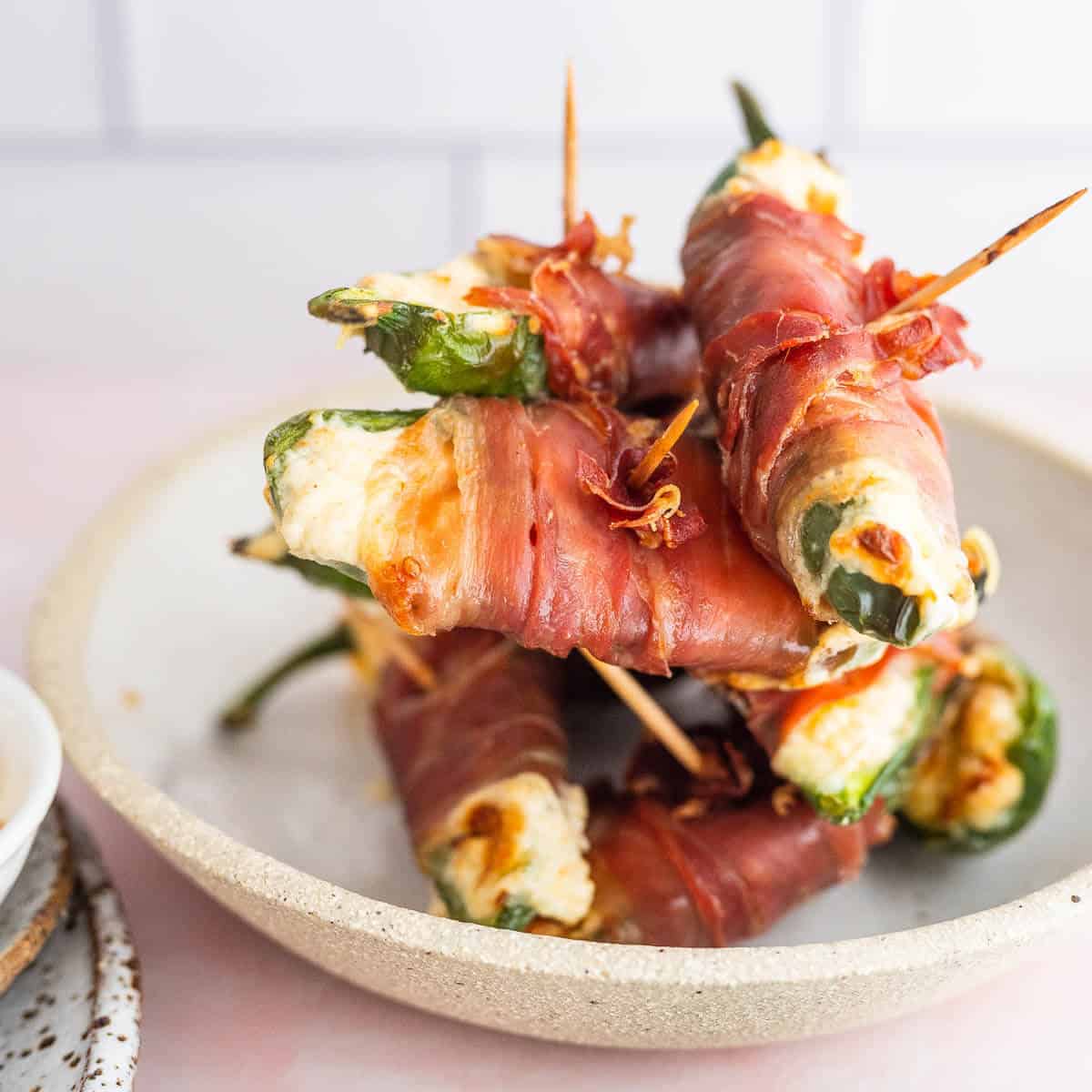 a stack of jalapeno poppers on  a plate