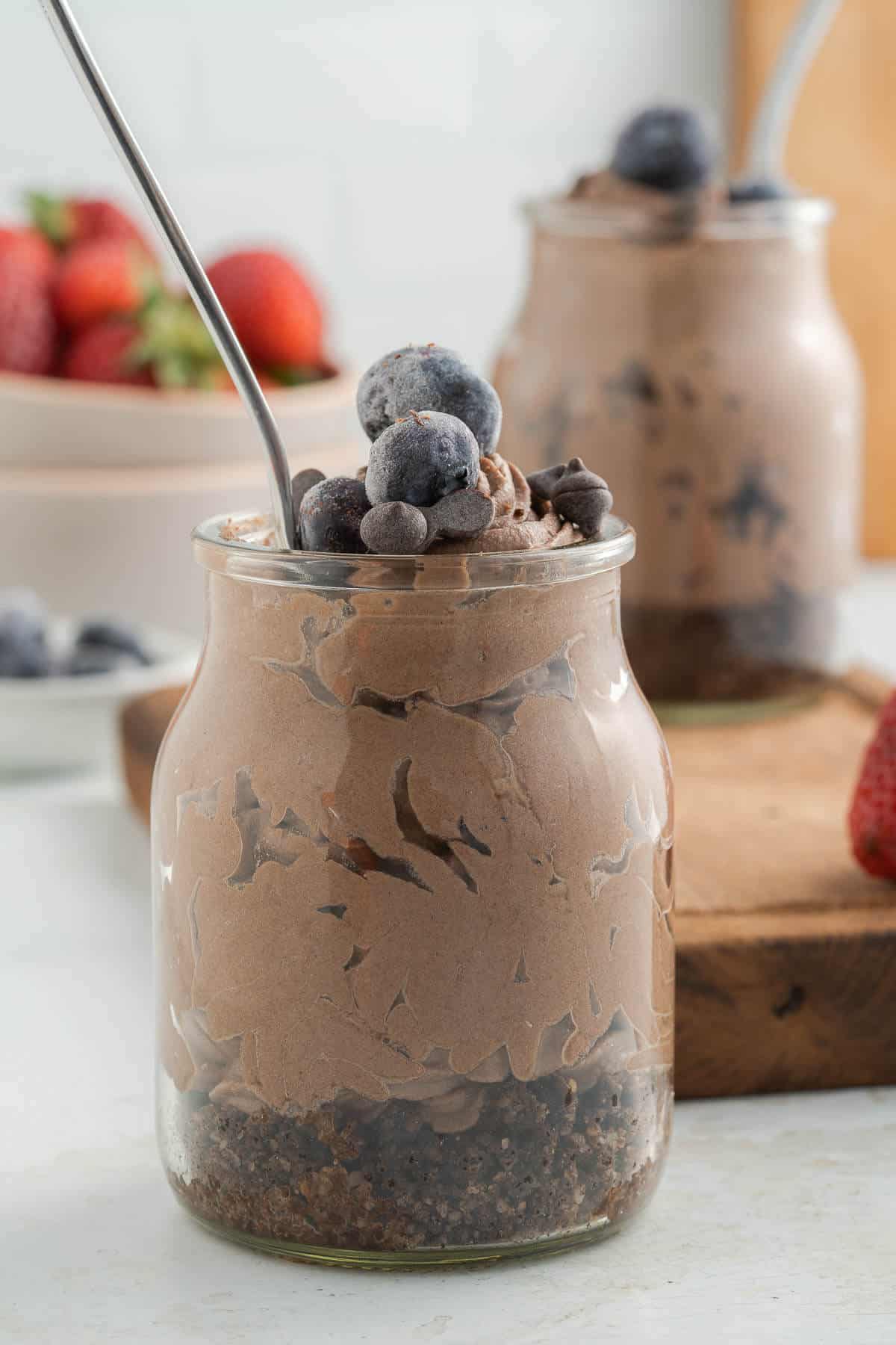 chocolate cheesecake jars with blueberries on top