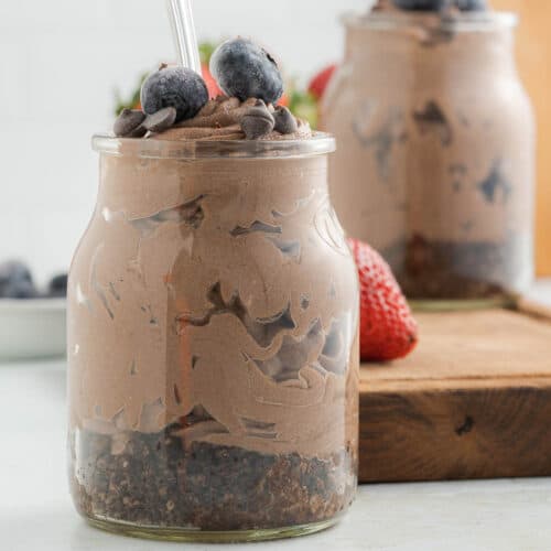 Chocolate cheesecake in a jar with blueberries