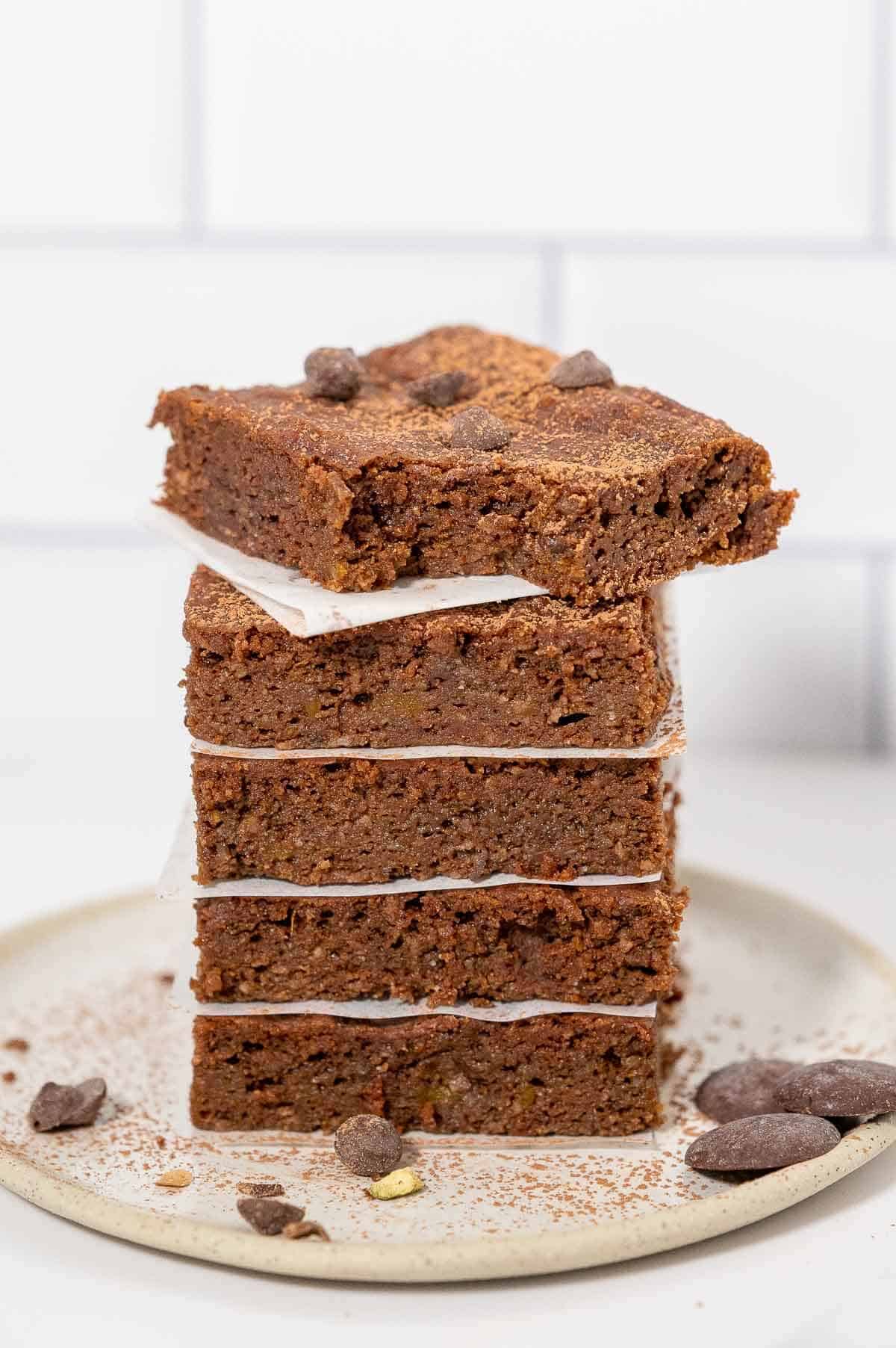 a stack of 5 pumpkin brownies with top one bite taken out