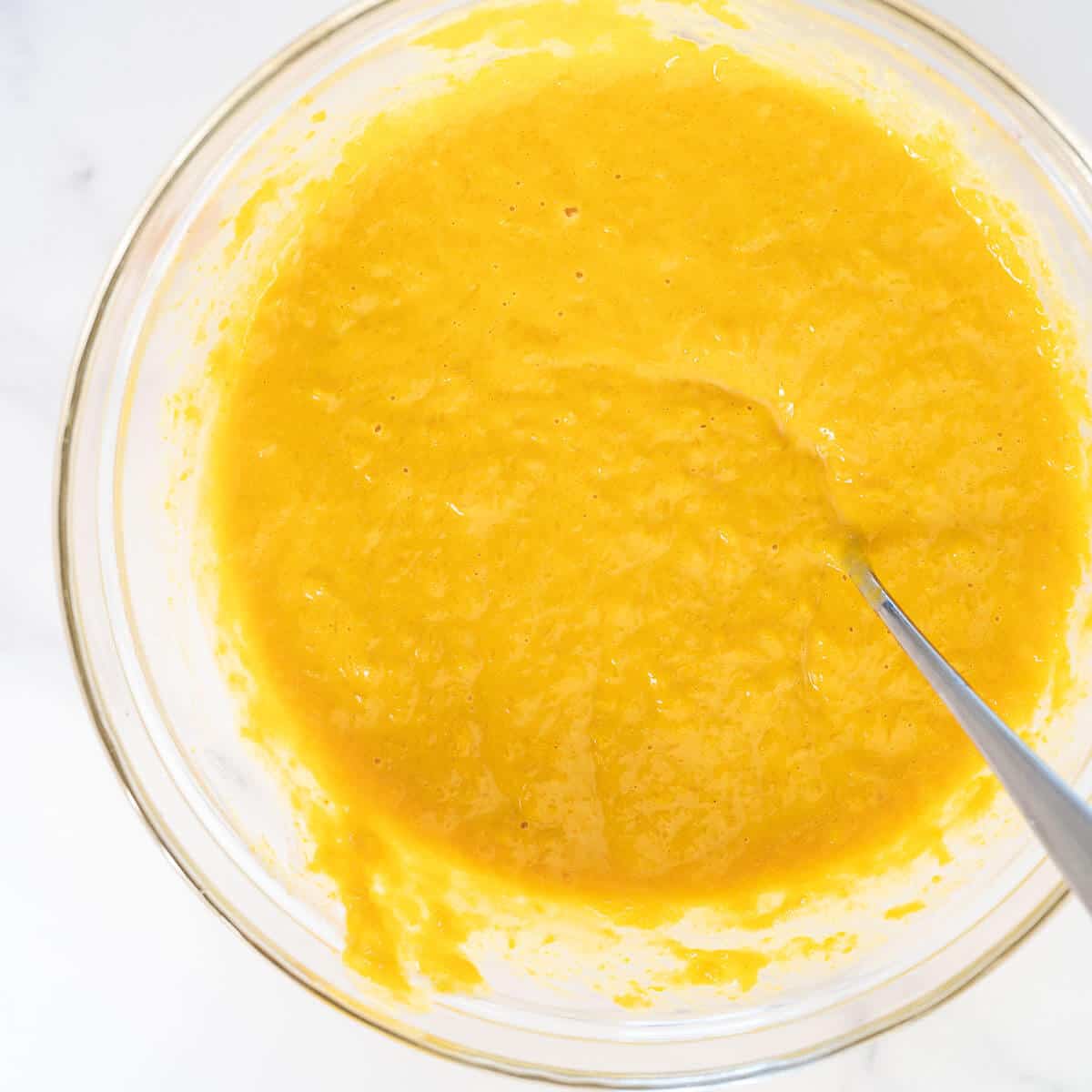 mixing pumpkin puree, egg and peanut butter in a bowl