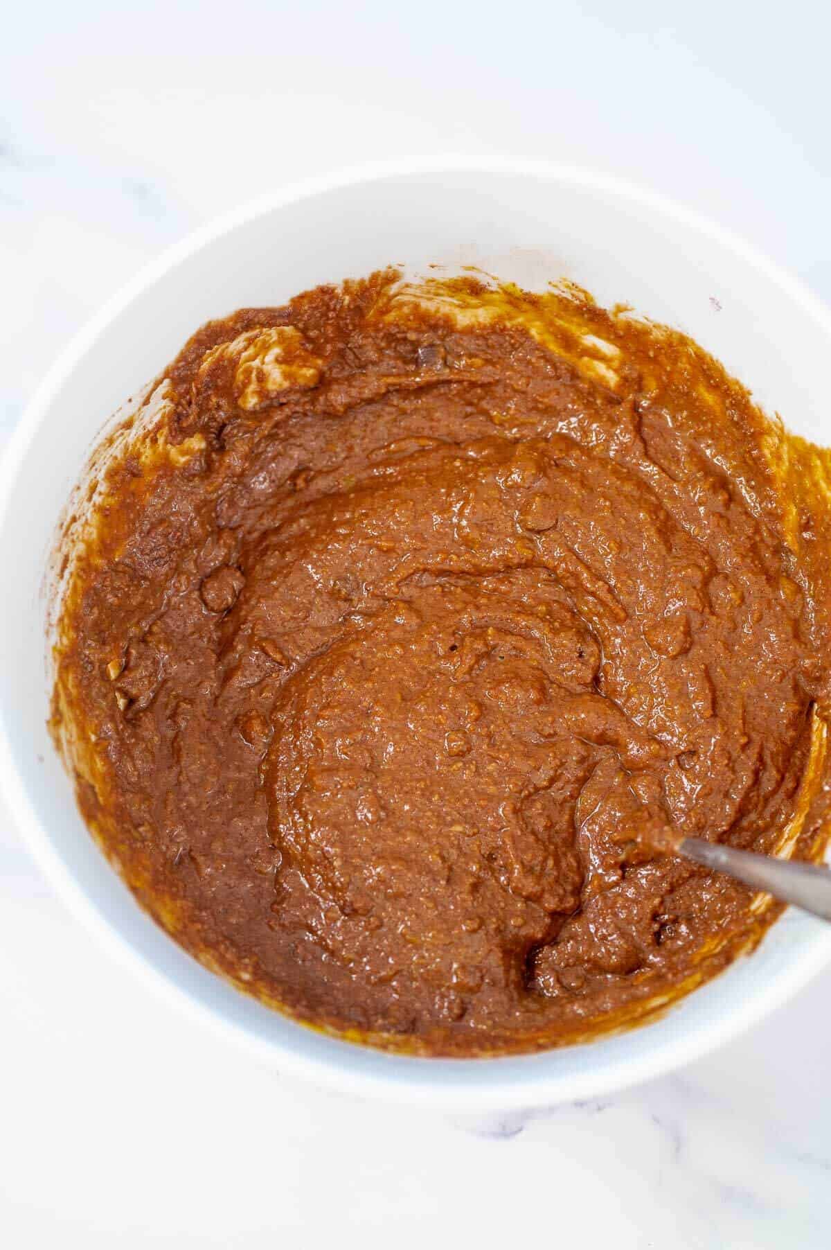 pumpkin brownie batter in a mixing bowl