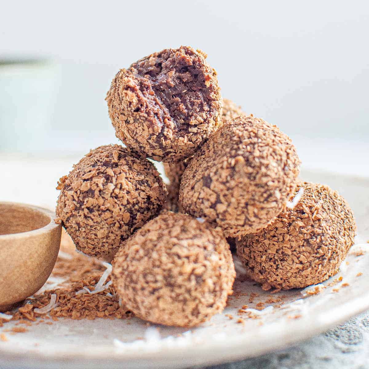 a stack of 6 weetbix balls with the top one having a bite taken out