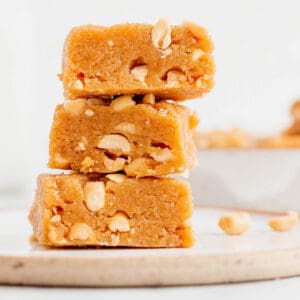 a stack of three healthy blondies with peanut butter