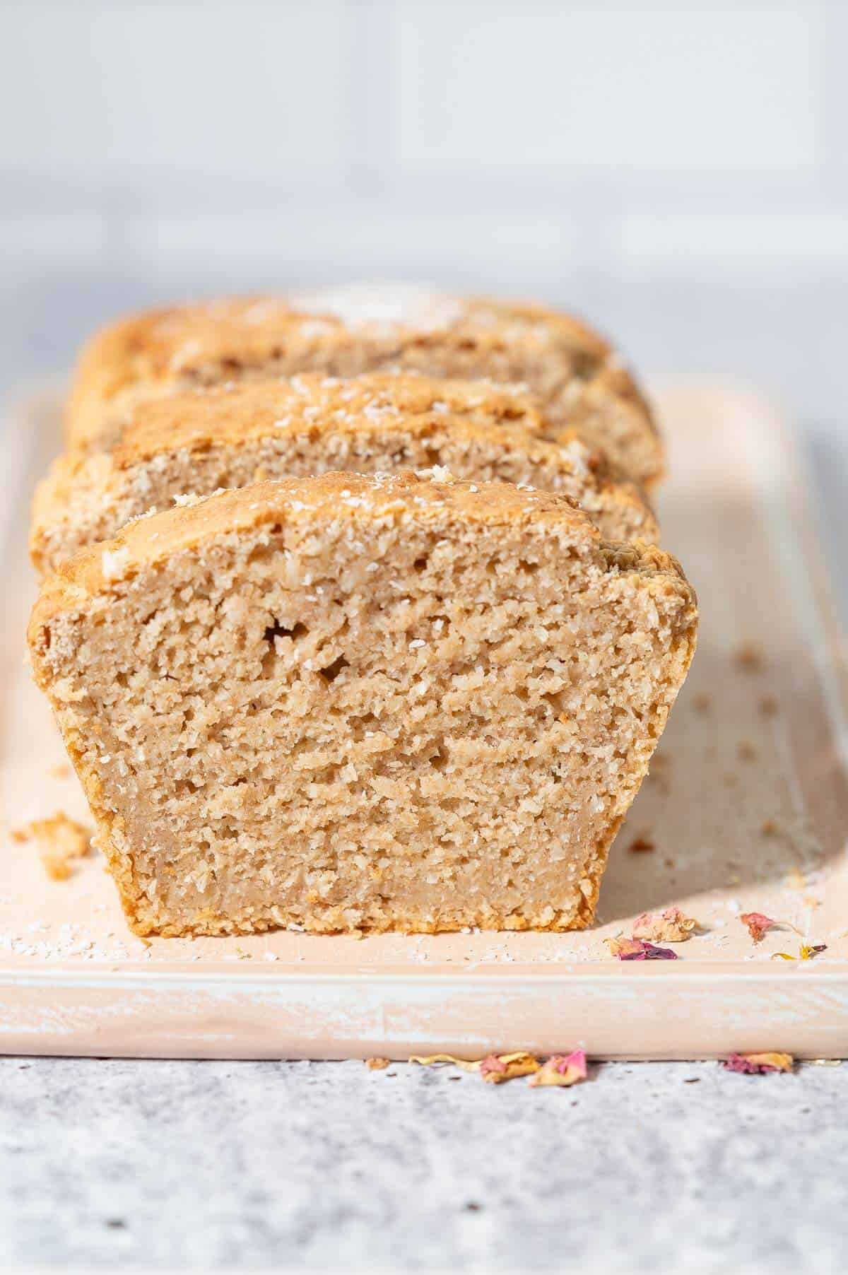 slices of coconut bread on a wooden serving board