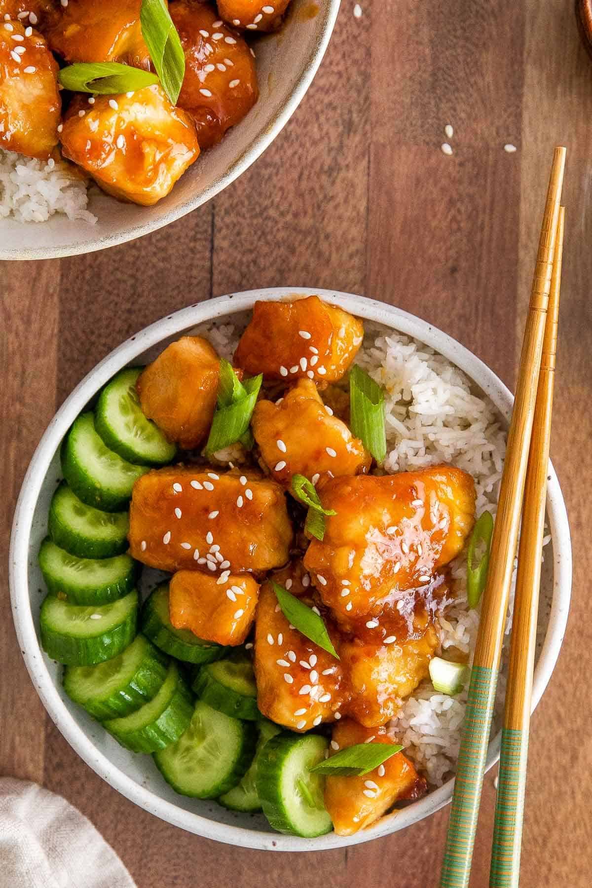 Honey garlic soy chicken bites with rice and chopsticks