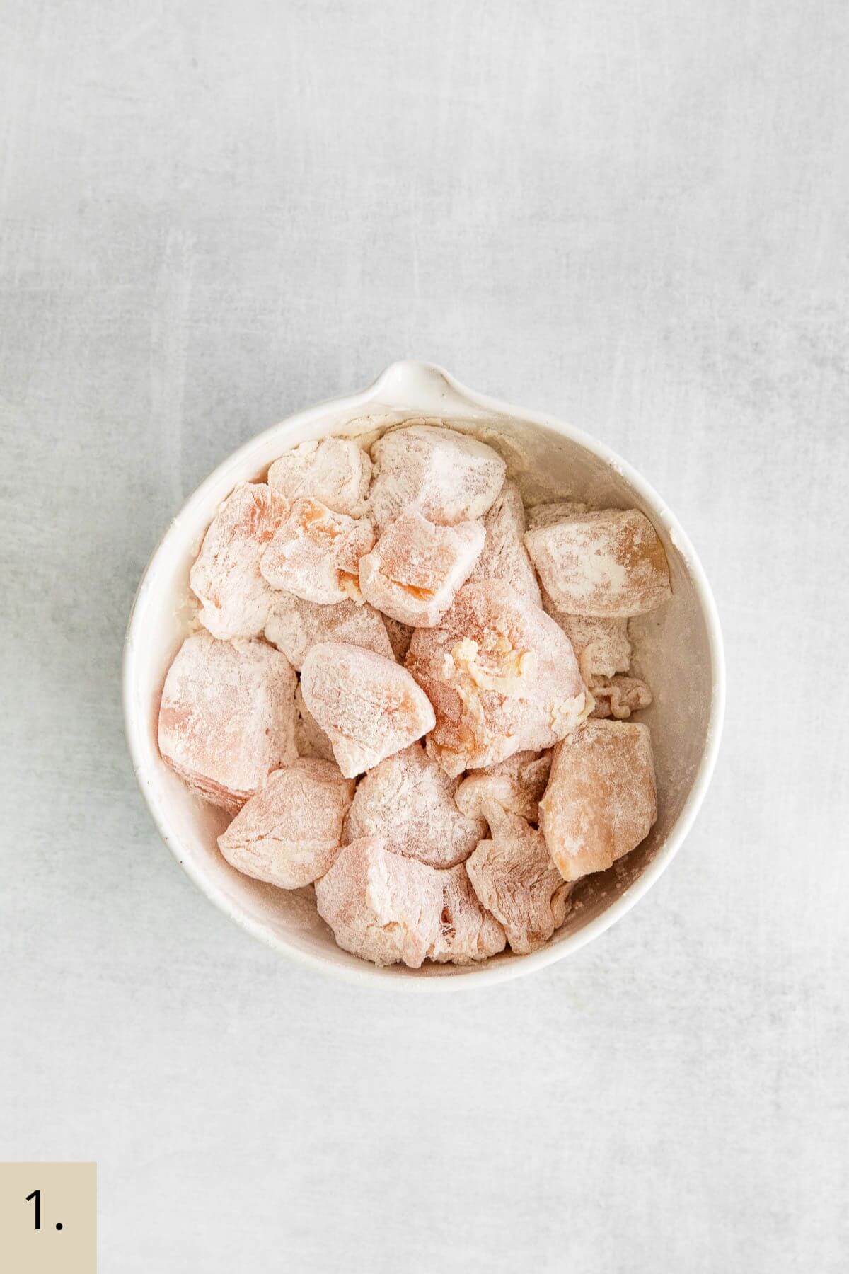 chicken and flour in a bowl