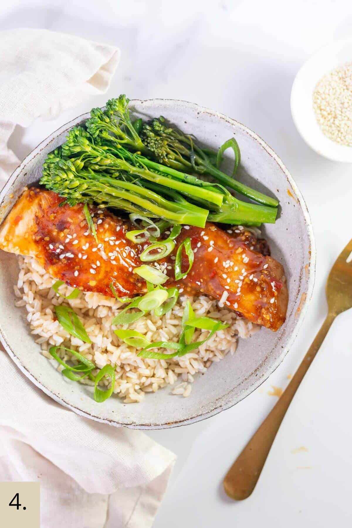 sweet chili salmon in a bowl with rice and brocolini