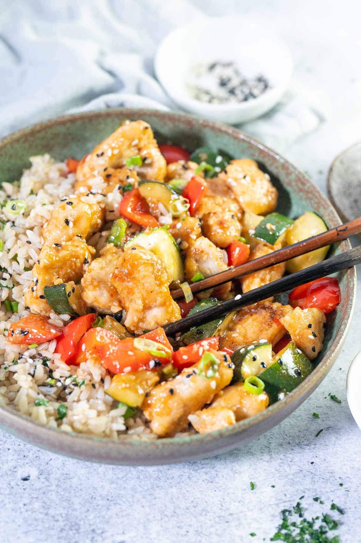 close up of sweet chilli chicken coated in sauce