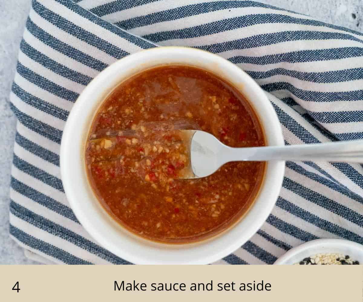 Sweet chilli sauce in a white dish with fork