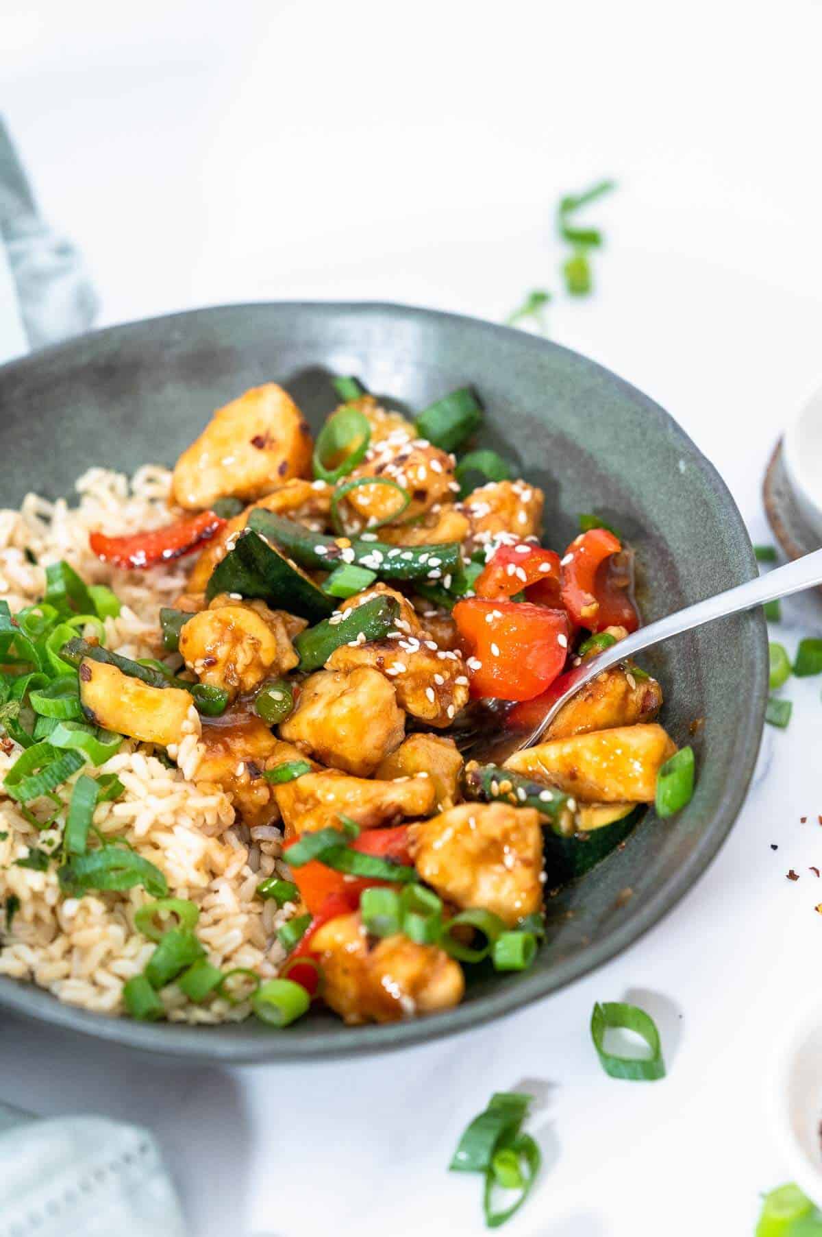 saucy mongolian chicken on a fork