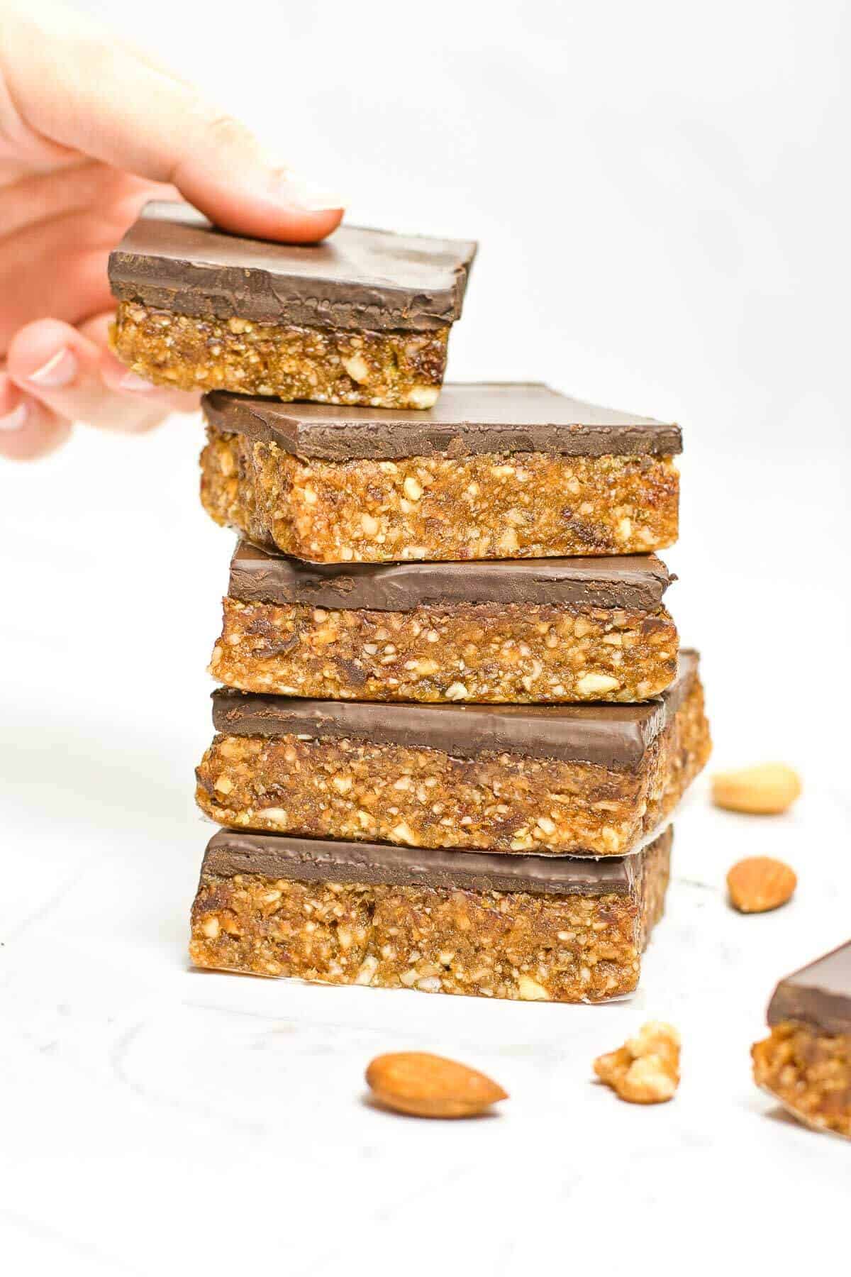 stack of 4 date bars and hand grabbing the top bar