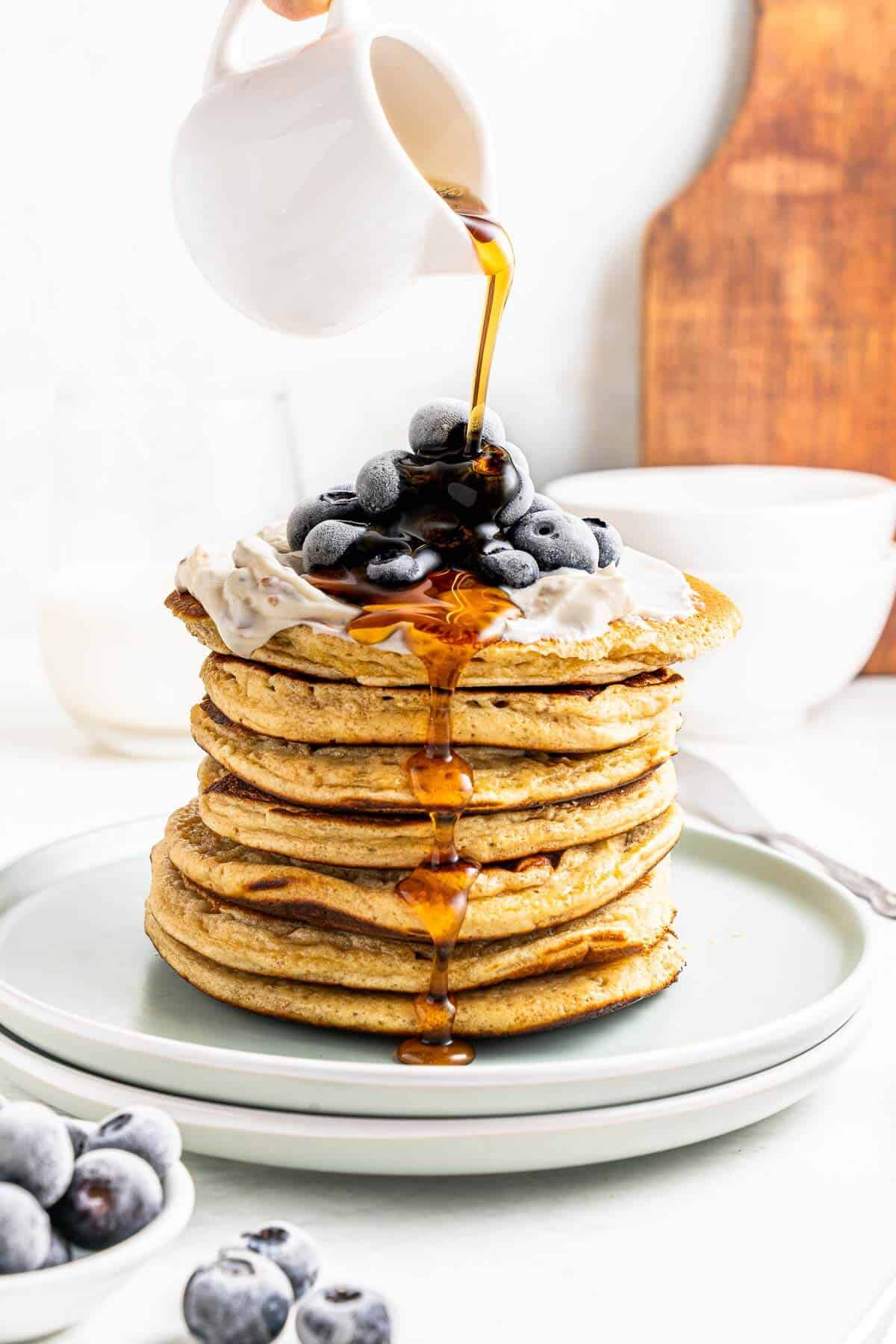 pouring syrup over healthy protein pancakes no banana