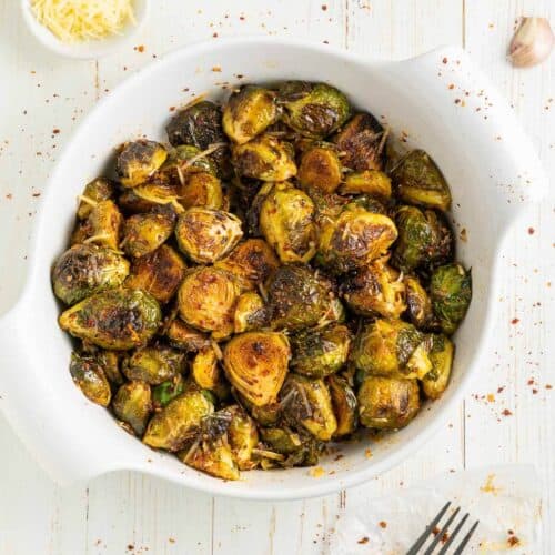 white pot full of cooked roasted brussel sprouts