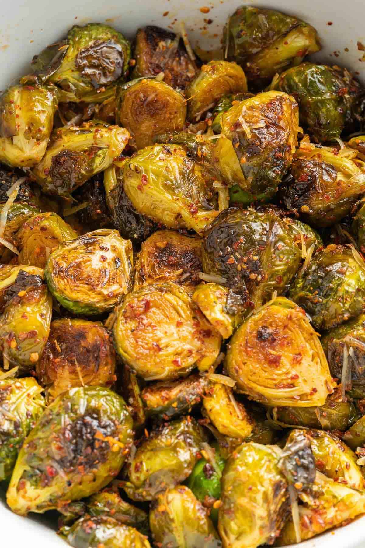 roasted brussel sprouts with parmesan and garlic in a serving dish