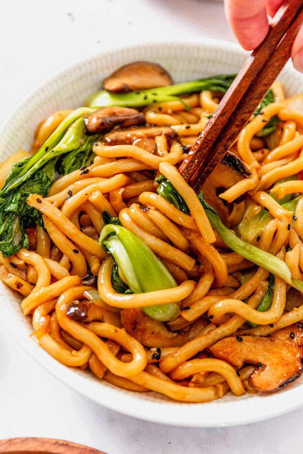 yaki soba noodles twirled around chopsticks