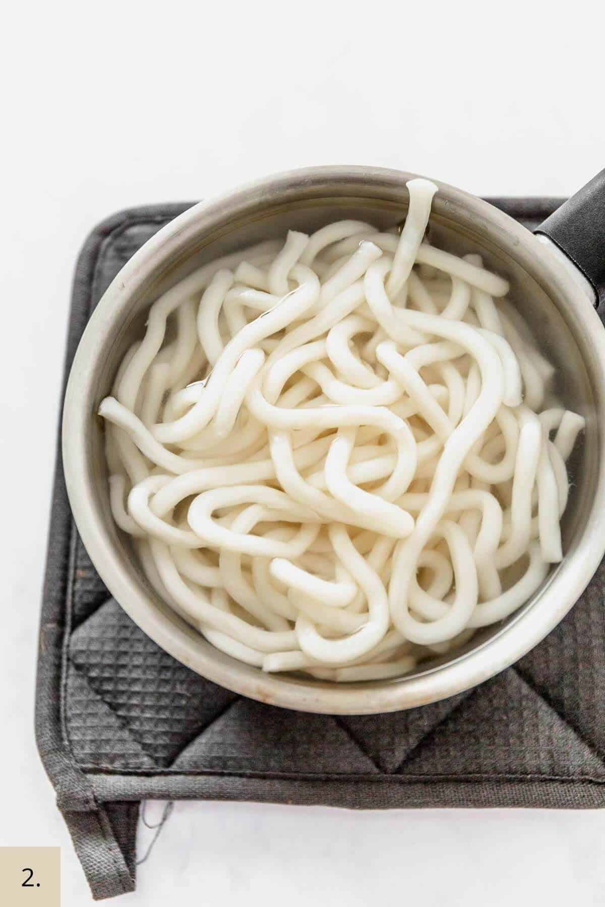 undon noodles in a bowl with water