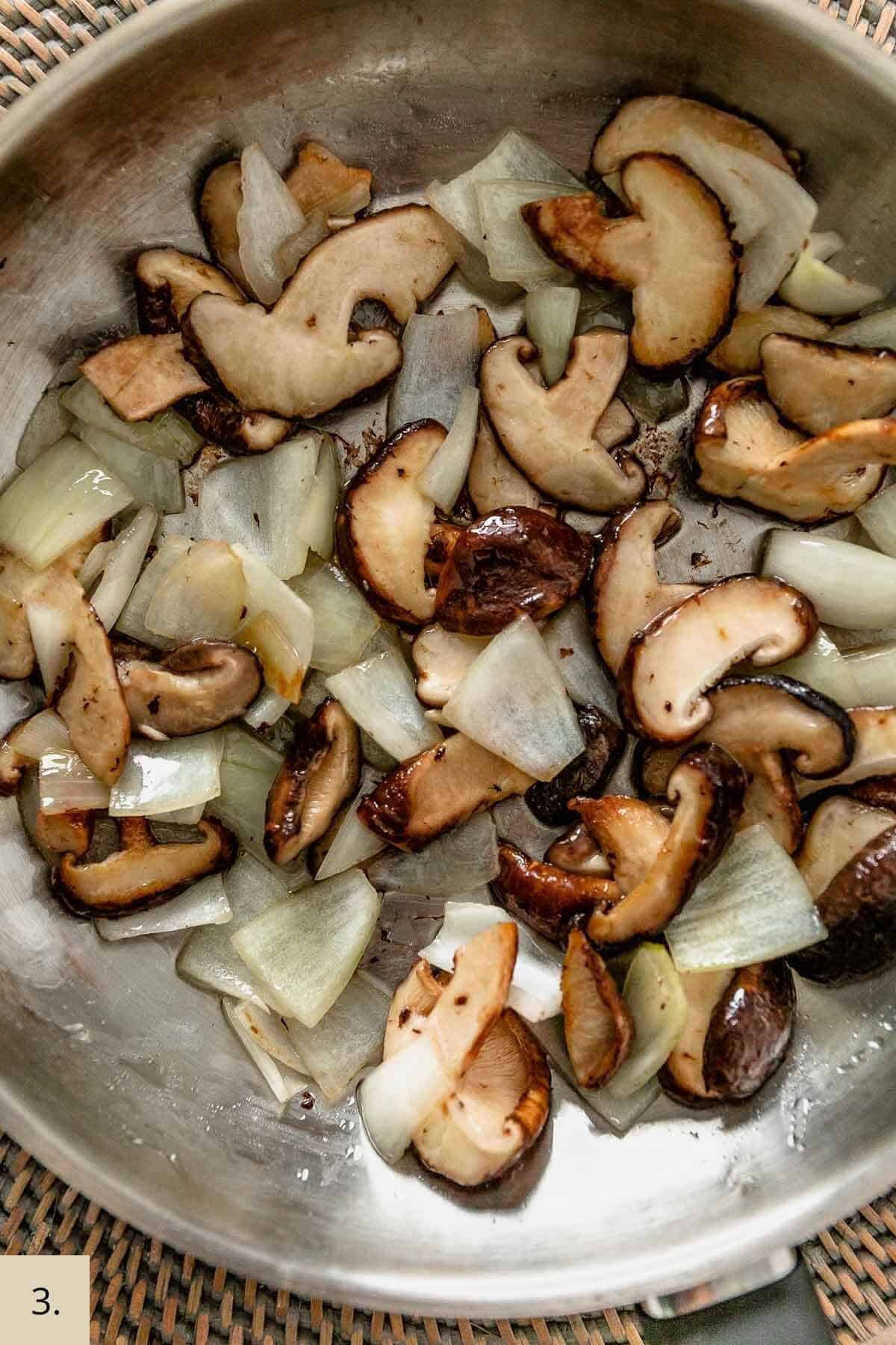 mushroom and onion frying in a pan