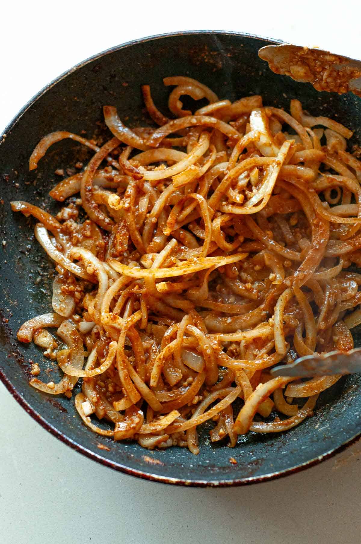 onions and garlic cooking in a pan