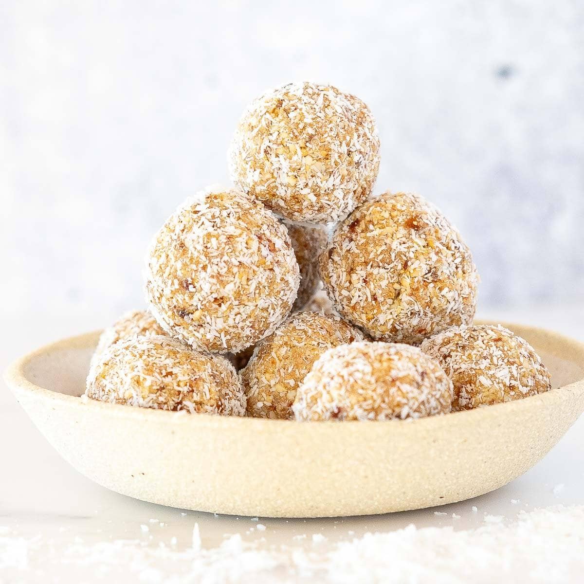 hi protein coconut stacked together balls in a bowl