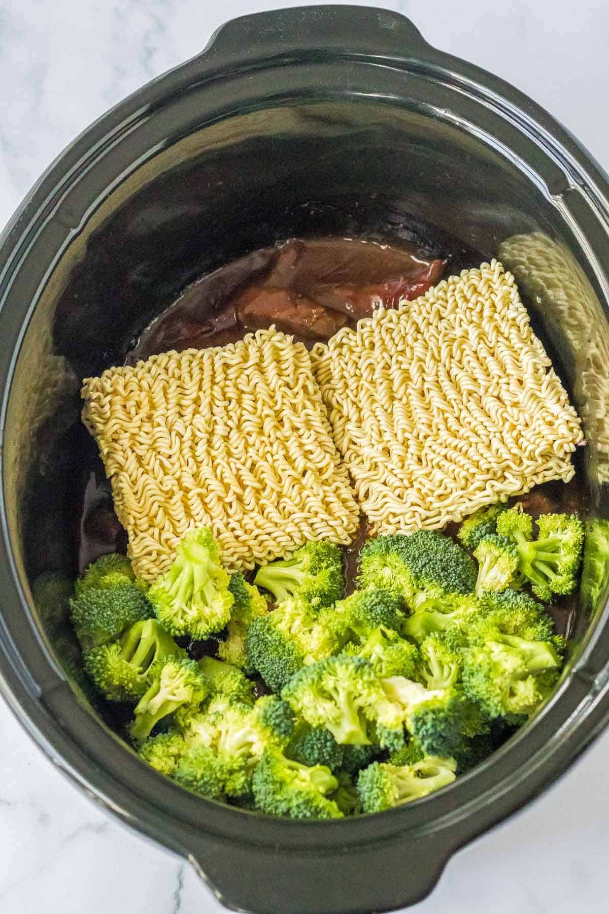 dry ramen noodles and broccoli in slow cooker