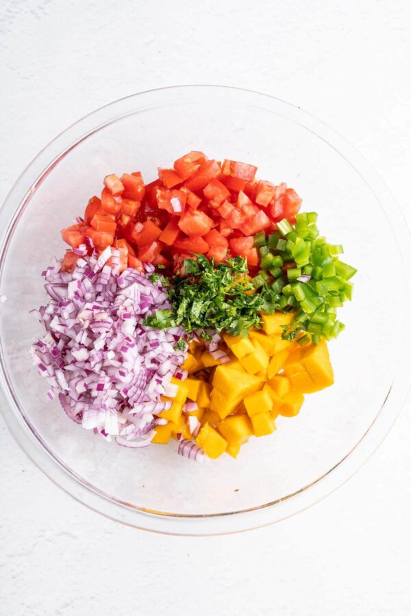 diced ingredients in a bowl to make mango salsa