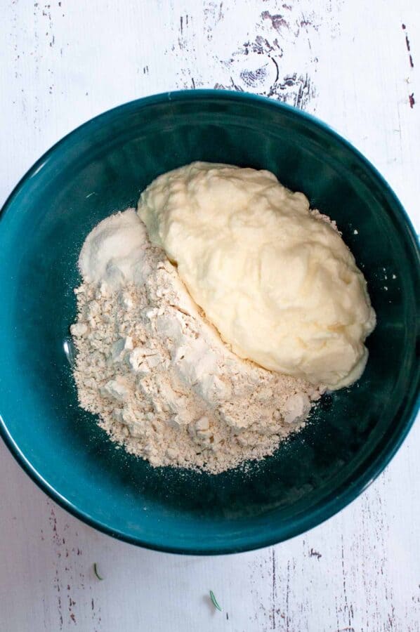 flour, baking powder and yoghurt in a mixing bowl