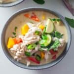 a bowl of thai chicken green curry that is low in calories