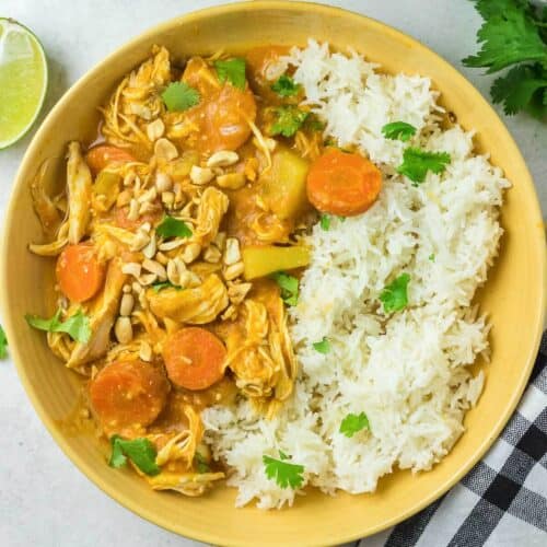 thai red chicken curry and vegetables in a bow with rice