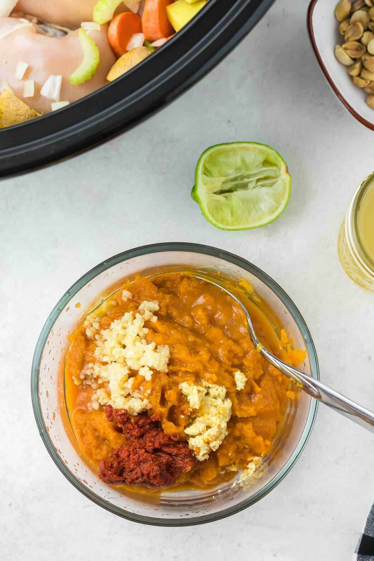 pumpkin puree, curry paste, garlic and ginger in a bowl