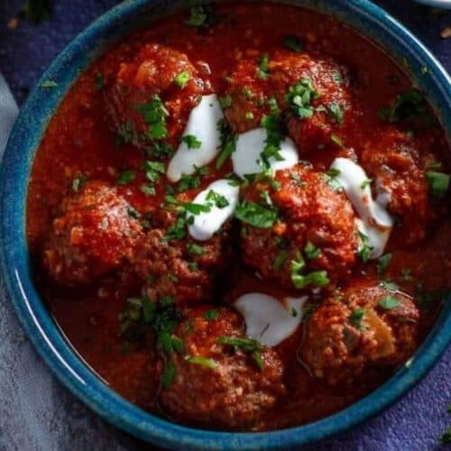 saucy meatballs in a blue bowl