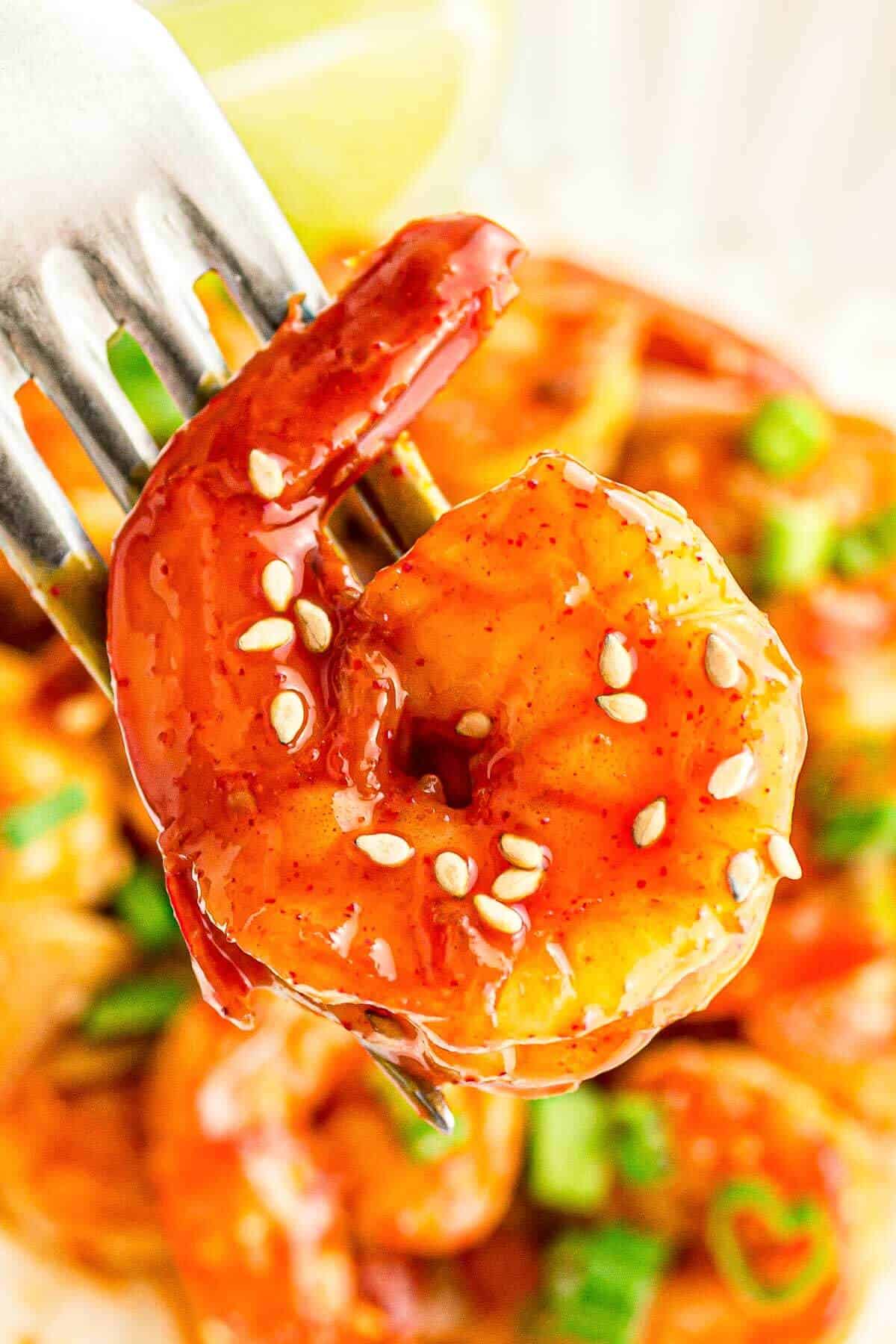 a single korean shrimp on a fork