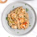 grey plate with garlic prawn and shrimp risotto