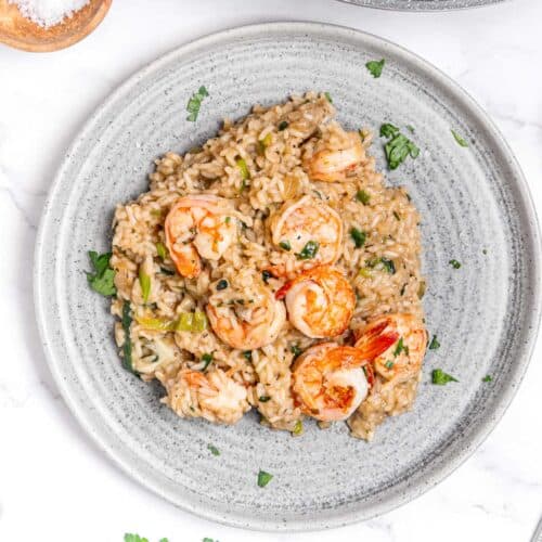 grey plate with garlic prawn and shrimp risotto