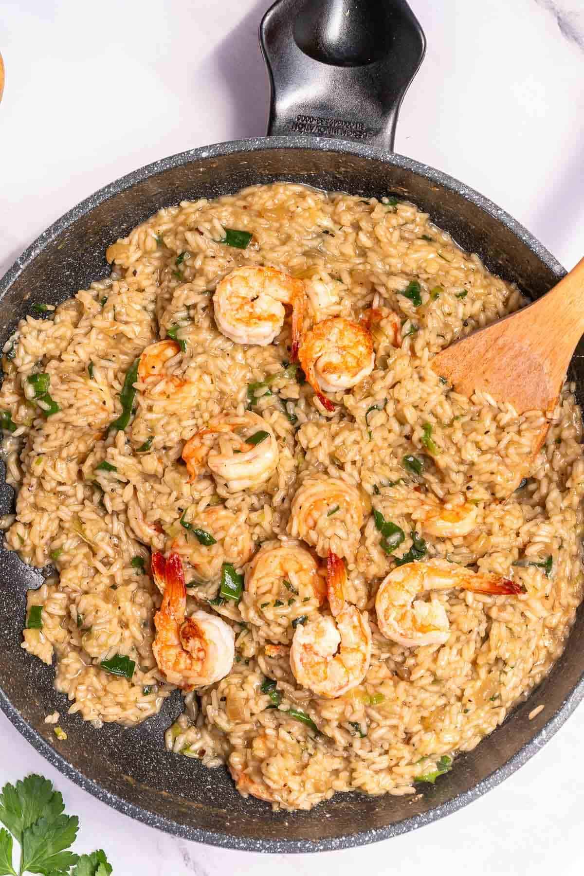 risotto skillet with creamy rice and cooked shrimp