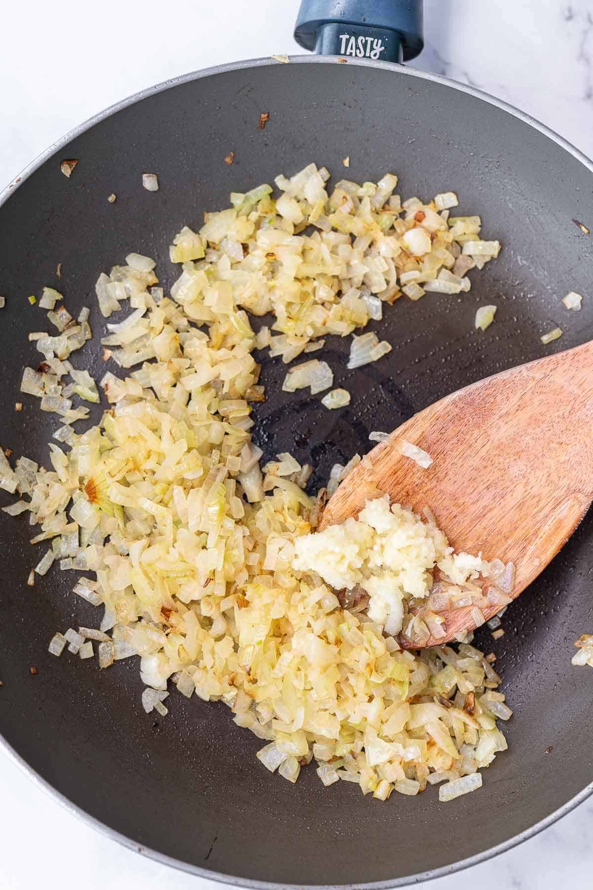 frying onion in a pan
