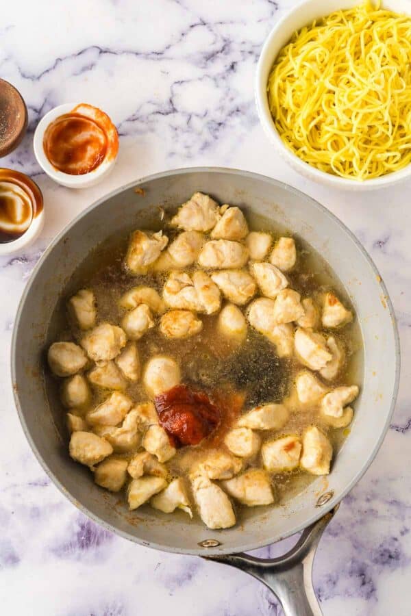 cooking chicken breast in broth with spices and sriracha