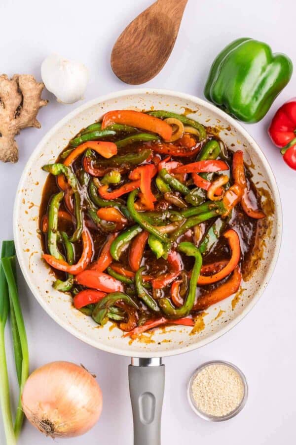 bell peppers cooking in black pepper sauce
