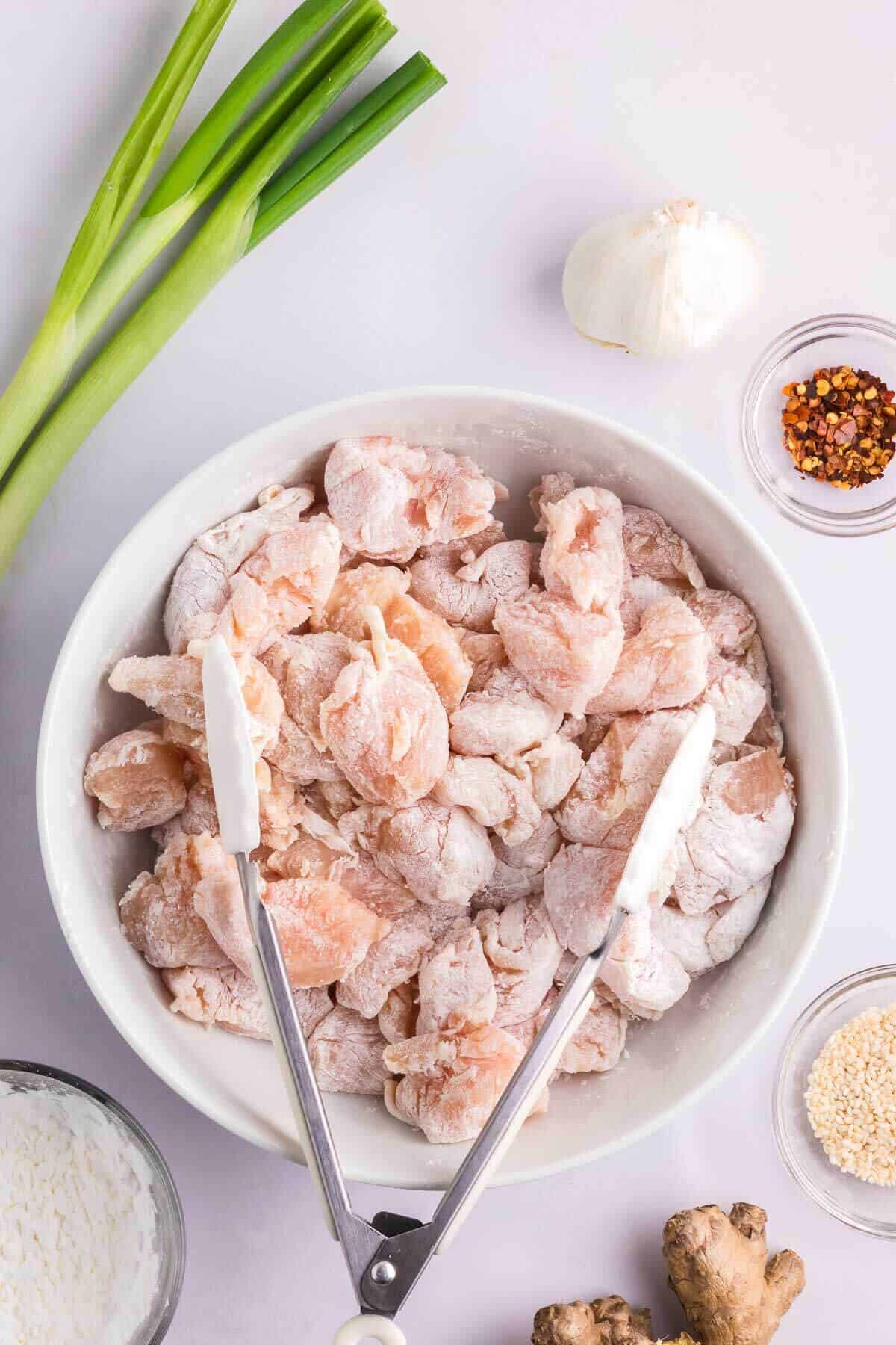 chicken breast bites covered in cornstarch