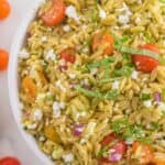 Big white bowl filled with basil pesto orzo pasta salad
