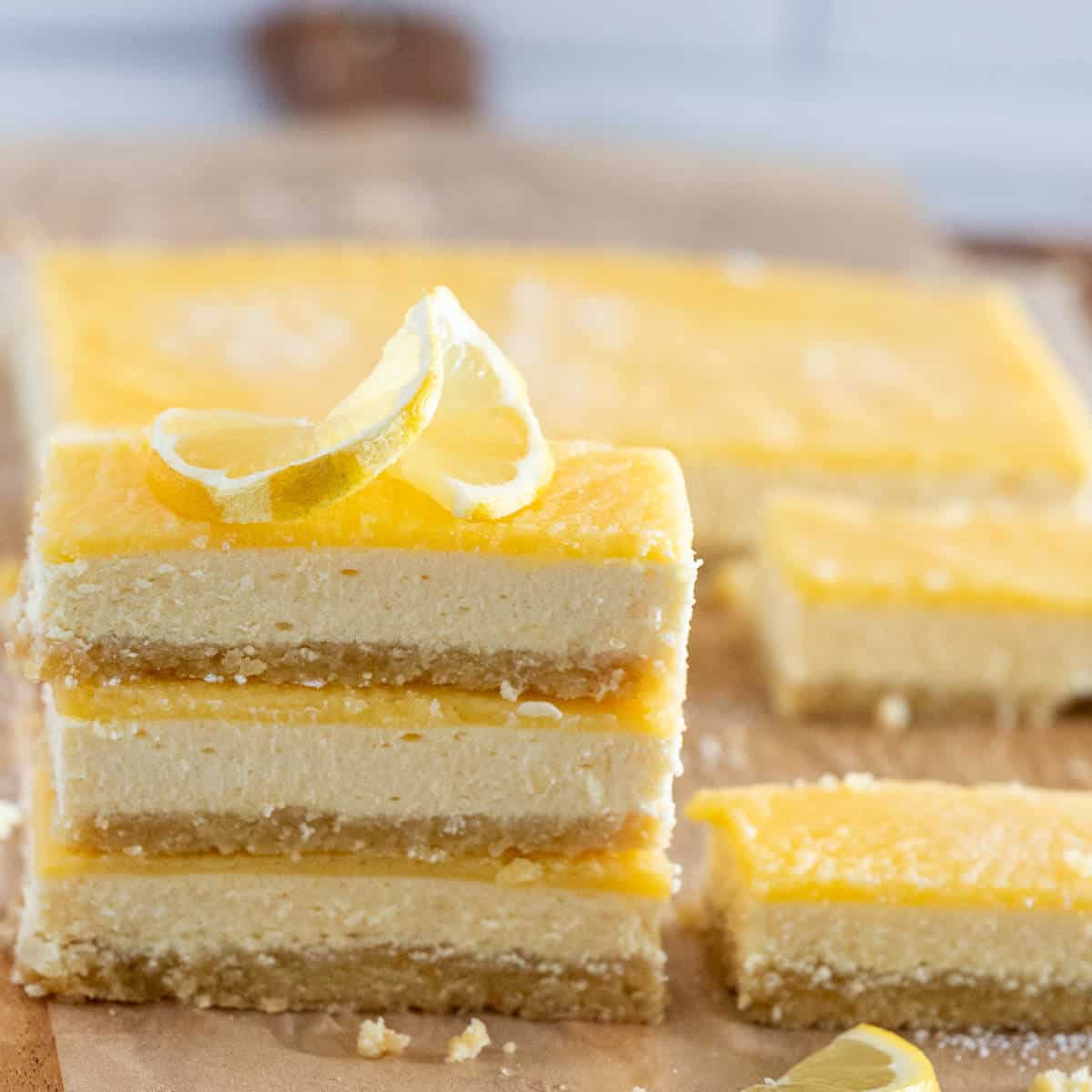no added sugar baked lemon cheesecake bars on a board