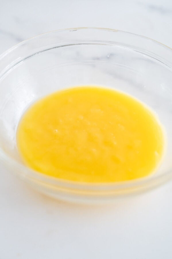 strained and smooth lemon curd in a bowl